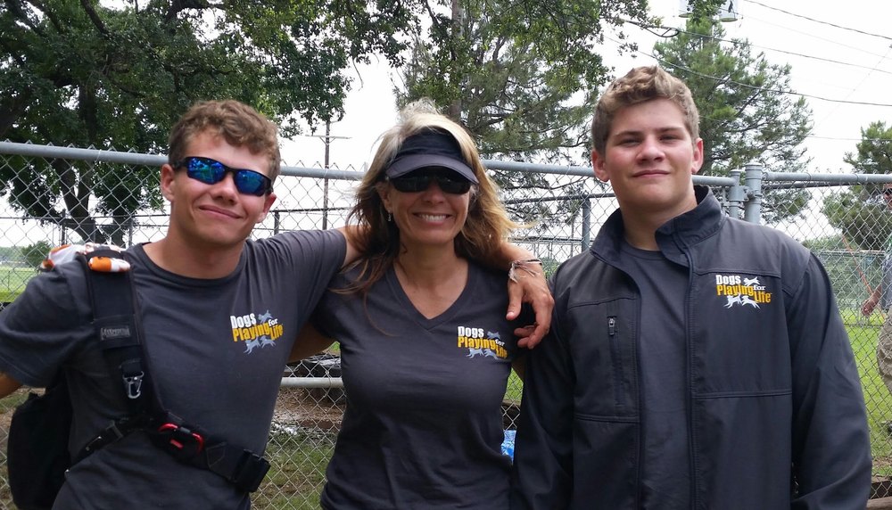Three Dogs Playing for Life team members wearing DPFL apparel